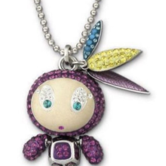 Authentic Swarovski Indian American feather 🪶 Cutie purple
